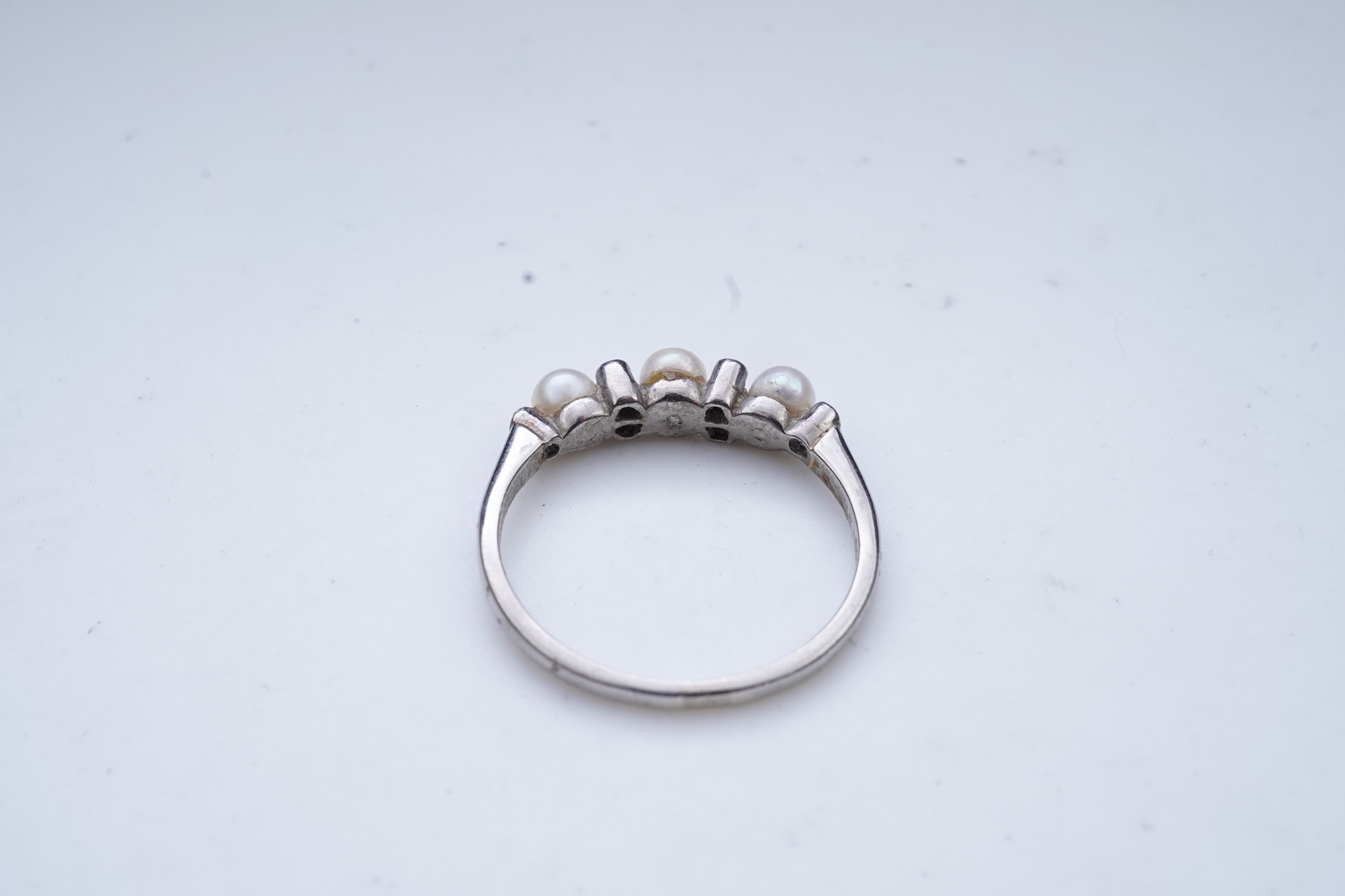 An Edwardian seed pearl brooch and a pearl and diamond ring